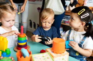 Children play with toys in a classroom